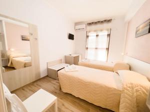 Postel nebo postele na pokoji v ubytování B&B BABBU MEU