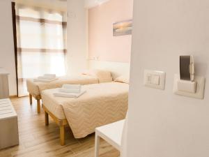 Postel nebo postele na pokoji v ubytování B&B BABBU MEU
