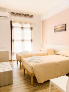 Postel nebo postele na pokoji v ubytování B&B BABBU MEU