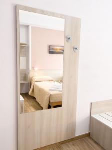 Postel nebo postele na pokoji v ubytování B&B BABBU MEU