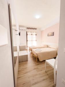 Postel nebo postele na pokoji v ubytování B&B BABBU MEU