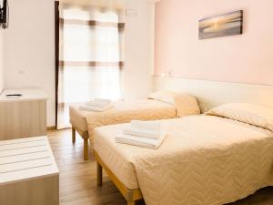 Postel nebo postele na pokoji v ubytování B&B BABBU MEU
