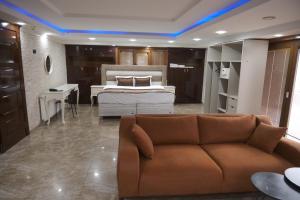a living room with a couch and a bed at Florya House Hotel in Istanbul