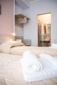 Postel nebo postele na pokoji v ubytování B&B BABBU MEU