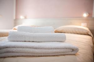 Postel nebo postele na pokoji v ubytování B&B BABBU MEU
