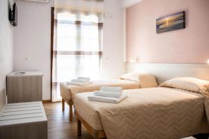 Postel nebo postele na pokoji v ubytování B&B BABBU MEU