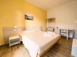 Postel nebo postele na pokoji v ubytování B&B BABBU MEU