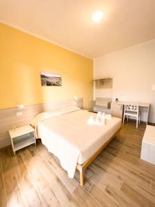 Postel nebo postele na pokoji v ubytování B&B BABBU MEU