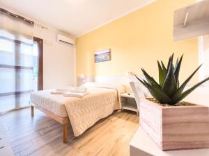Postel nebo postele na pokoji v ubytování B&B BABBU MEU