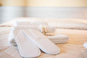 Postel nebo postele na pokoji v ubytování B&B BABBU MEU