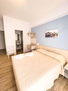 Postel nebo postele na pokoji v ubytování B&B BABBU MEU