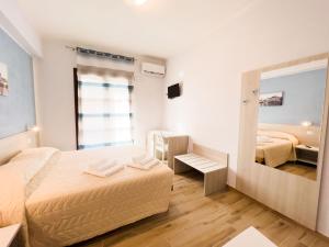 Postel nebo postele na pokoji v ubytování B&B BABBU MEU