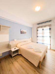 Postel nebo postele na pokoji v ubytování B&B BABBU MEU