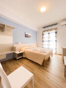 Postel nebo postele na pokoji v ubytování B&B BABBU MEU