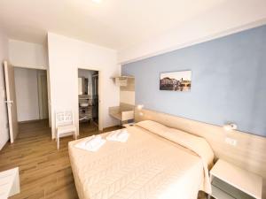 Postel nebo postele na pokoji v ubytování B&B BABBU MEU