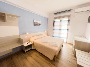 Postel nebo postele na pokoji v ubytování B&B BABBU MEU