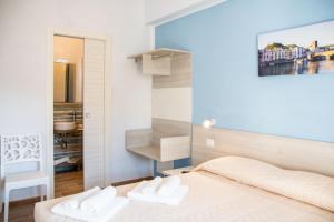 Postel nebo postele na pokoji v ubytování B&B BABBU MEU