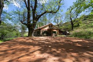 a house in the middle of a dirt road at Hani Kastania - Chania retreat for families and groups for holidays and workshops in Sémbronas