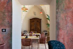 a dining room with a table and chairs at Masseria Santo Scalone in Ostuni
