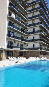 a large apartment building with a large swimming pool at DXN Luxury Apartment 5 in Năvodari