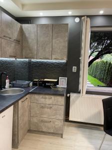 A kitchen or kitchenette at Beta House Apartments