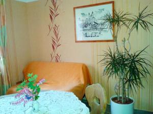 a living room with a table and a chair and a table and a tableablish at Landhaus Wachau in Aggsbach