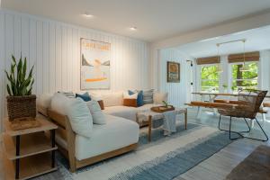 a living room with a couch and a table at Blue Moon Cottage in Lake Lure
