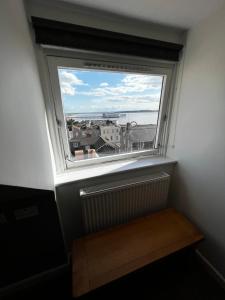 a window in a room with a radiator and a view at Queenswood Hotel in Weston-super-Mare