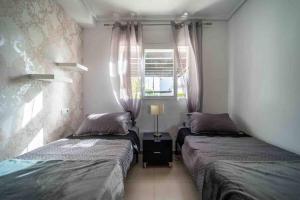 Postel nebo postele na pokoji v ubytování Casa Dorada Townhouse La Torre Golf