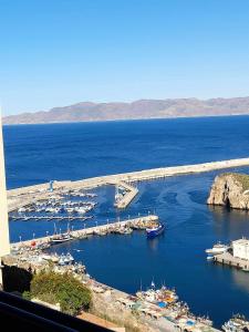 a view of a harbor with boats in the water at Al-marsa2 in Al Hoceïma