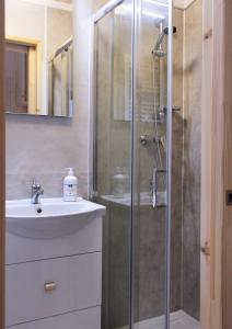 a bathroom with a shower and a sink at Camping la Pineta in Santa Maria Maggiore
