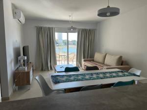 a living room with a bed and a couch at Departamento en Posadas in Posadas +18 photos