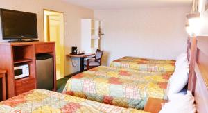 Ένα ή περισσότερα κρεβάτια σε δωμάτιο στο Alpine Motel