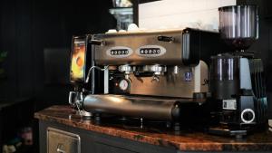 a coffee maker sitting on top of a counter at Hotel Nuovo Sole HNS in Bovolone