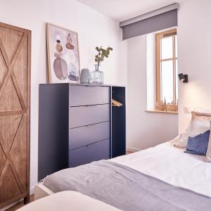 Łóżko lub łóżka w pokoju w obiekcie Gîte des Victoires