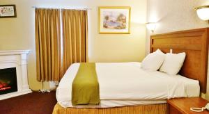 Ένα ή περισσότερα κρεβάτια σε δωμάτιο στο Alpine Motel