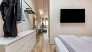 A television and/or entertainment centre at Cavalino Boutique 1