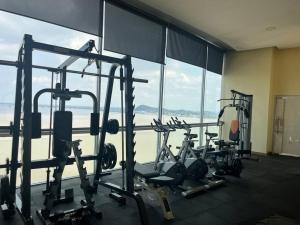 a gym with several tread machines in front of a window at Suite en Puerto Santa Ana! in Guayaquil