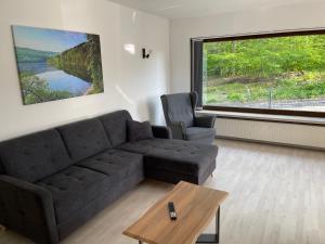 Posezení v ubytování Ferienwohnung Zum Wildpark