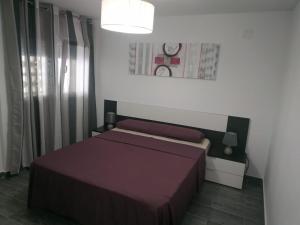 Posteľ alebo postele v izbe v ubytovaní Cullera Relax