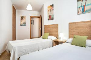 Postel nebo postele na pokoji v ubytování Casa Señores Cura 1 - Solo Familias