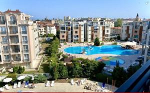 a view of a resort with a swimming pool and buildings at Rainbow 3 Sunny Beach Topo Apartment in Sunny Beach +14 photos