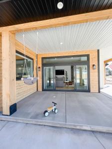 a house with a scooter parked in front of a building at LUXURY MODERN FAMILY VACATION- Bison Ridge Retreat in Show Low +37 photos