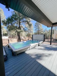 a large swimming pool on a deck at LUXURY MODERN FAMILY VACATION- Bison Ridge Retreat in Show Low