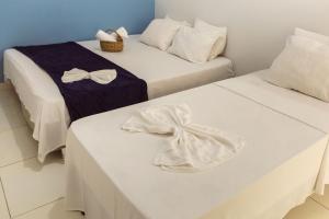 Łóżko lub łóżka w pokoju w obiekcie FLAT TOP COM 02 QUARTOS a 100m da ORLA de ATALAIA na TEMPORADA737