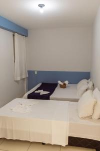 Una cama o camas en una habitación de FLAT TOP COM 02 QUARTOS a 100m da ORLA de ATALAIA na TEMPORADA737