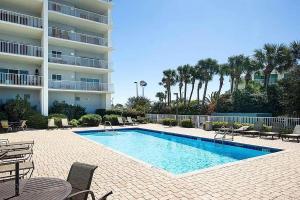 a swimming pool in front of a hotel at South Harbour 12E in Pensacola Beach