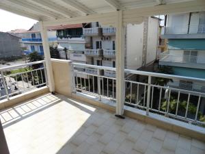 a balcony with a view of a building at All Summer Villa Dafni in Olympic Beach