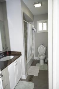 a bathroom with a sink and a toilet at Nathan’s Place in Brampton