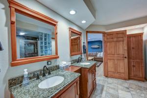 a bathroom with two sinks and a large mirror at Great Salida Getaway - 20 minutes to Monarch with Spa & Gameroom in Salida +67 photos